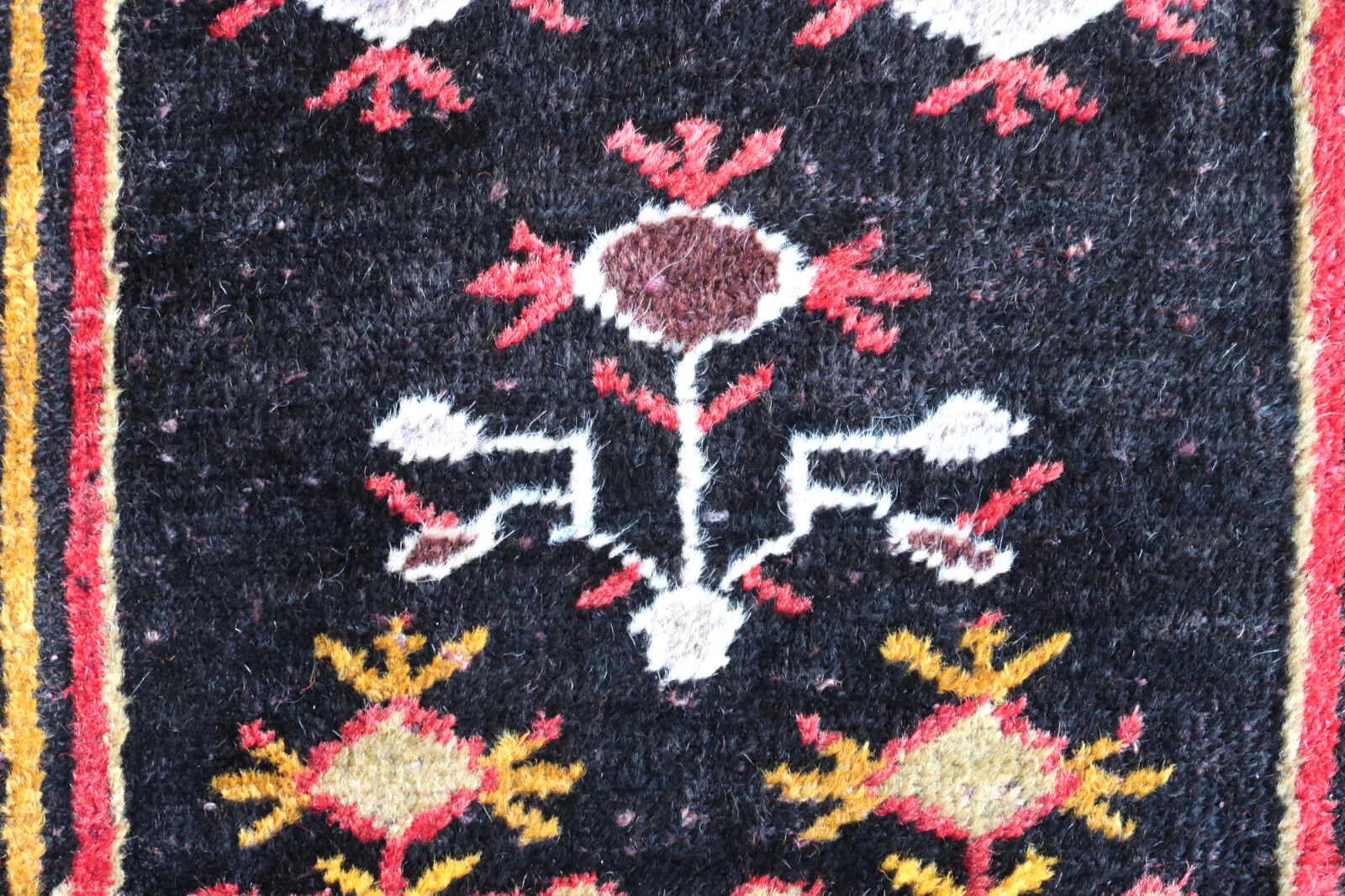 Handmade vintage Turkish Anatolian rug in traditional tribal design. The rug is from the middle of 20th century in original good condition.