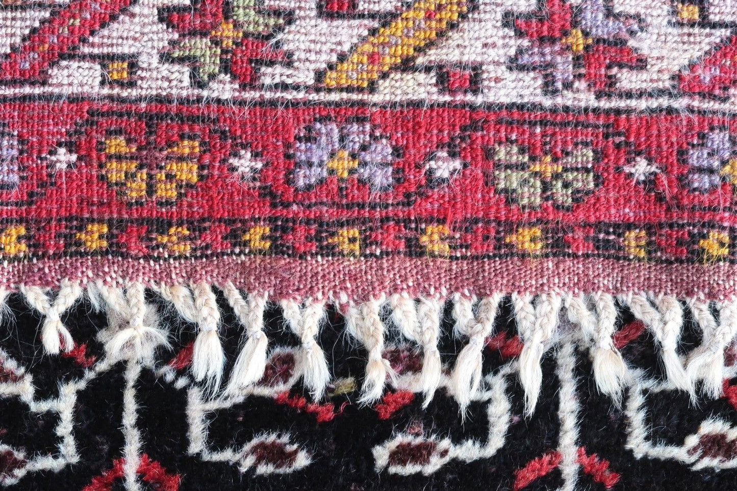 Handmade vintage Turkish Anatolian rug in traditional tribal design. The rug is from the middle of 20th century in original good condition.
