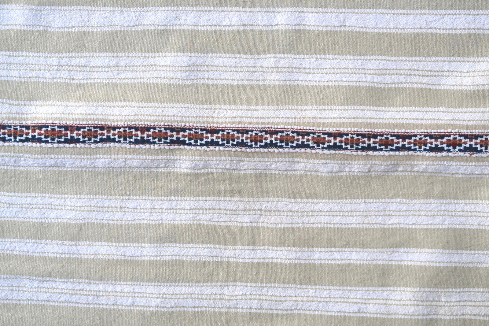 Handmade vintage Moroccan woolen kilim in white color with the stripes. This flatweave is from the middle of 20th century in original good condition.