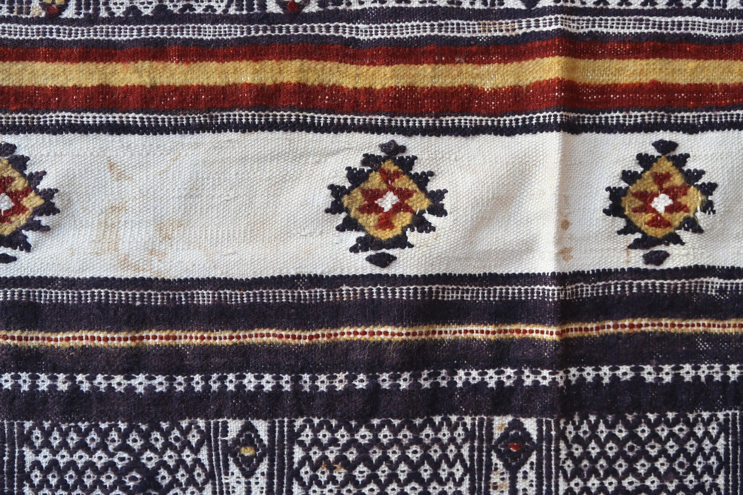 Handmade vintage Moroccan woolen kilim in stripes. This flatweave is from the middle of 20th century in original good condition.