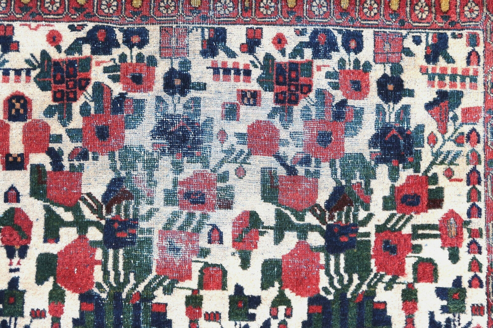 Handmade antique Persian Afshar rug in white color and all-over floral design. The rug is from the beginning of 20th century in original condition, the rug has low pile at some areas.