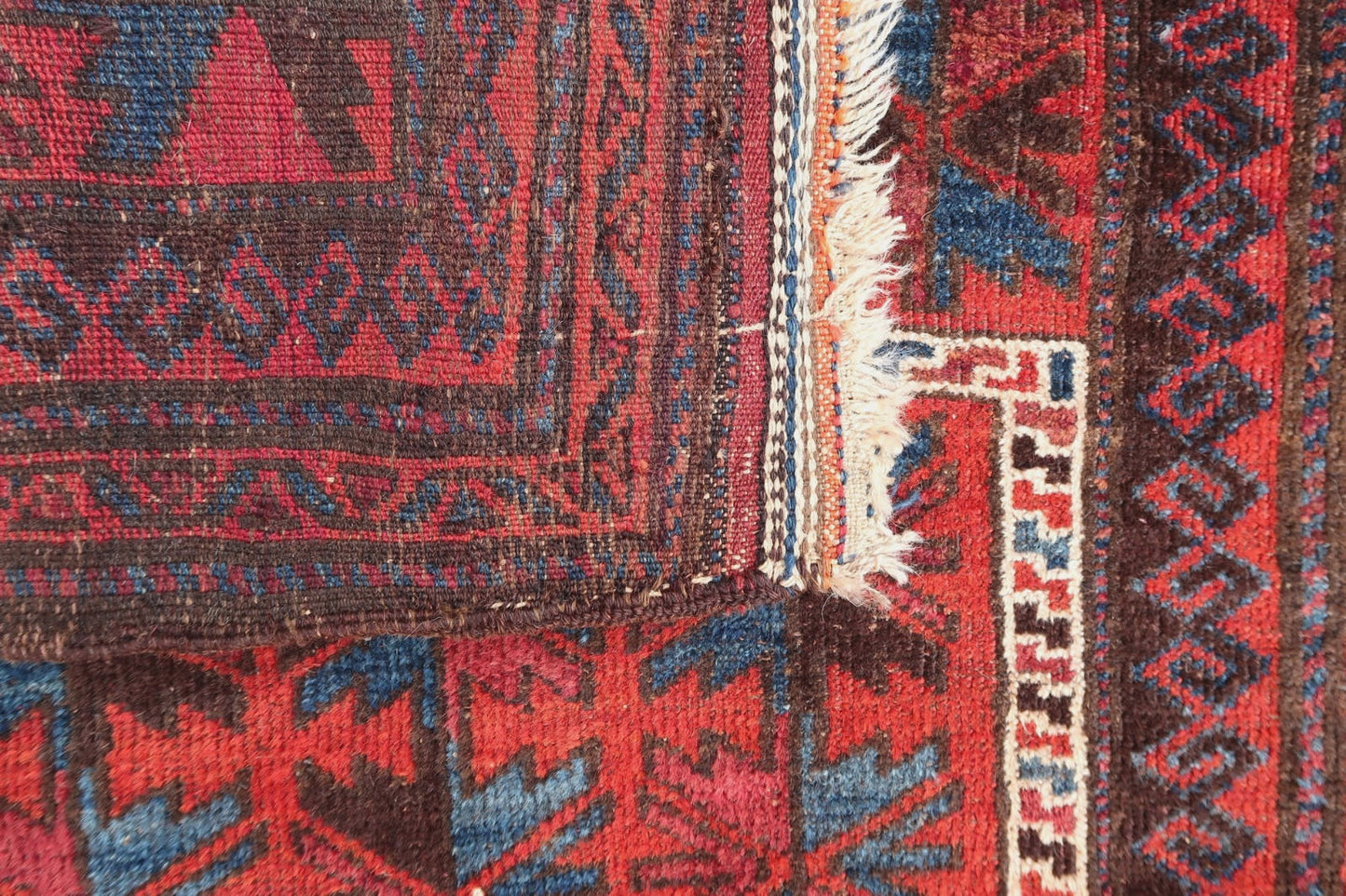 Handmade vintage Afghan Baluch rug in praying design. The rug is from the middle of 20th century in original good condition.