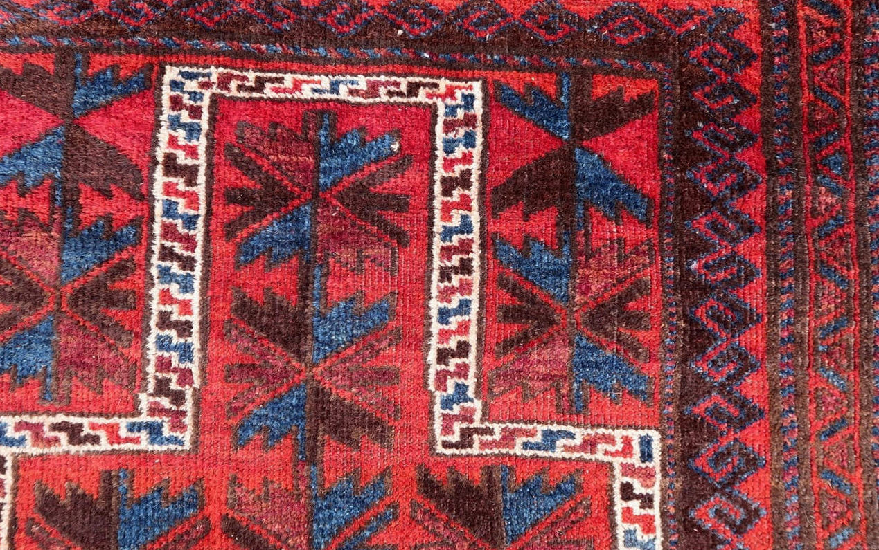 Handmade vintage Afghan Baluch rug in praying design. The rug is from the middle of 20th century in original good condition.