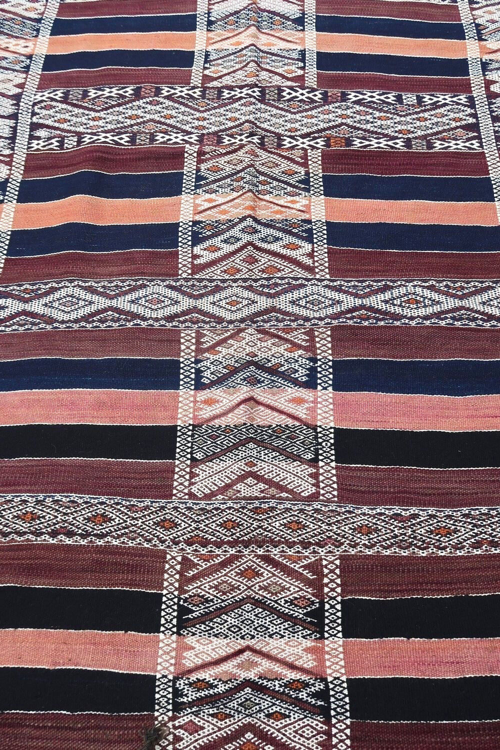 Handmade vintage Moroccan Berber kilim in geometric design. The rug is from the middle of 20th century in original good condition.