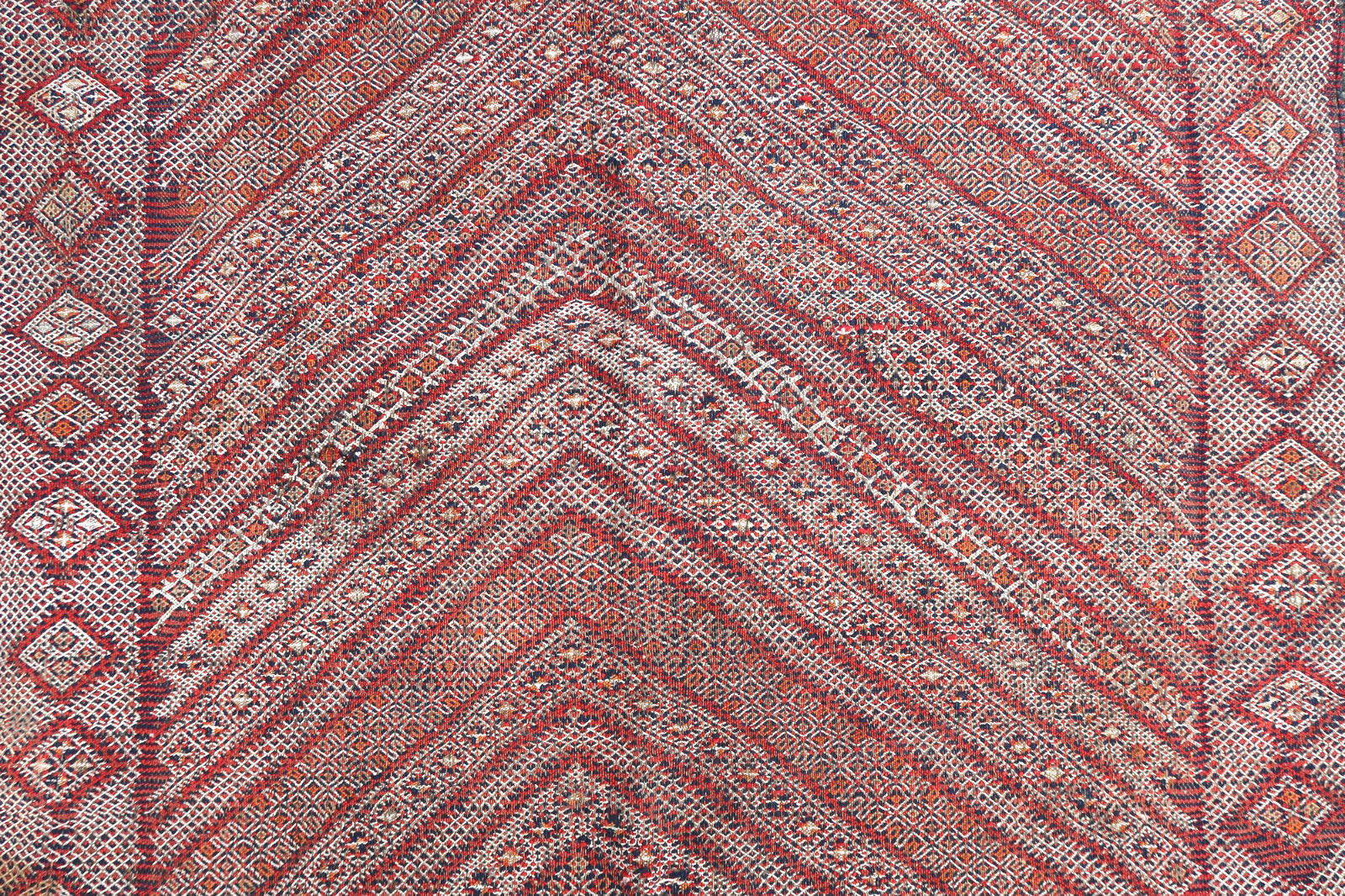 Handmade antique Moroccan Berber kilim in geometric design from Atlas region. The rug is from the end of 19th century generally in good condition, it has some age wear and old restorations. This type of rugs has been made for a personal use and not for trading.