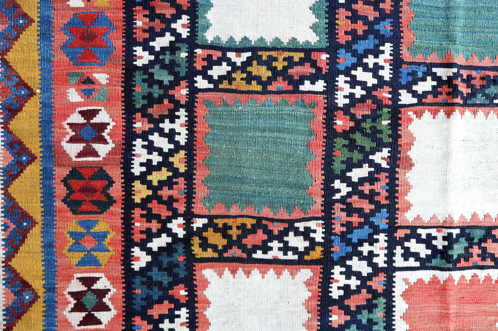 Handmade antique kilim from Persian Gashkai region in geometric design. This flatweave is in original good condition, it is from the beginning of 20th century.