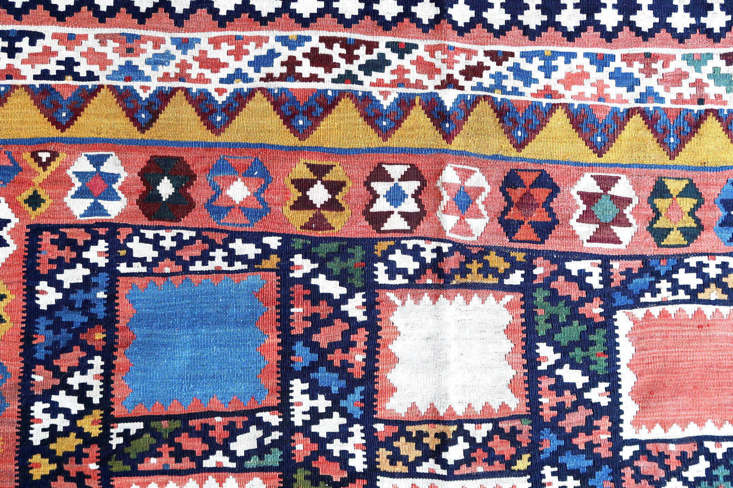Handmade antique kilim from Persian Gashkai region in geometric design. This flatweave is in original good condition, it is from the beginning of 20th century.
