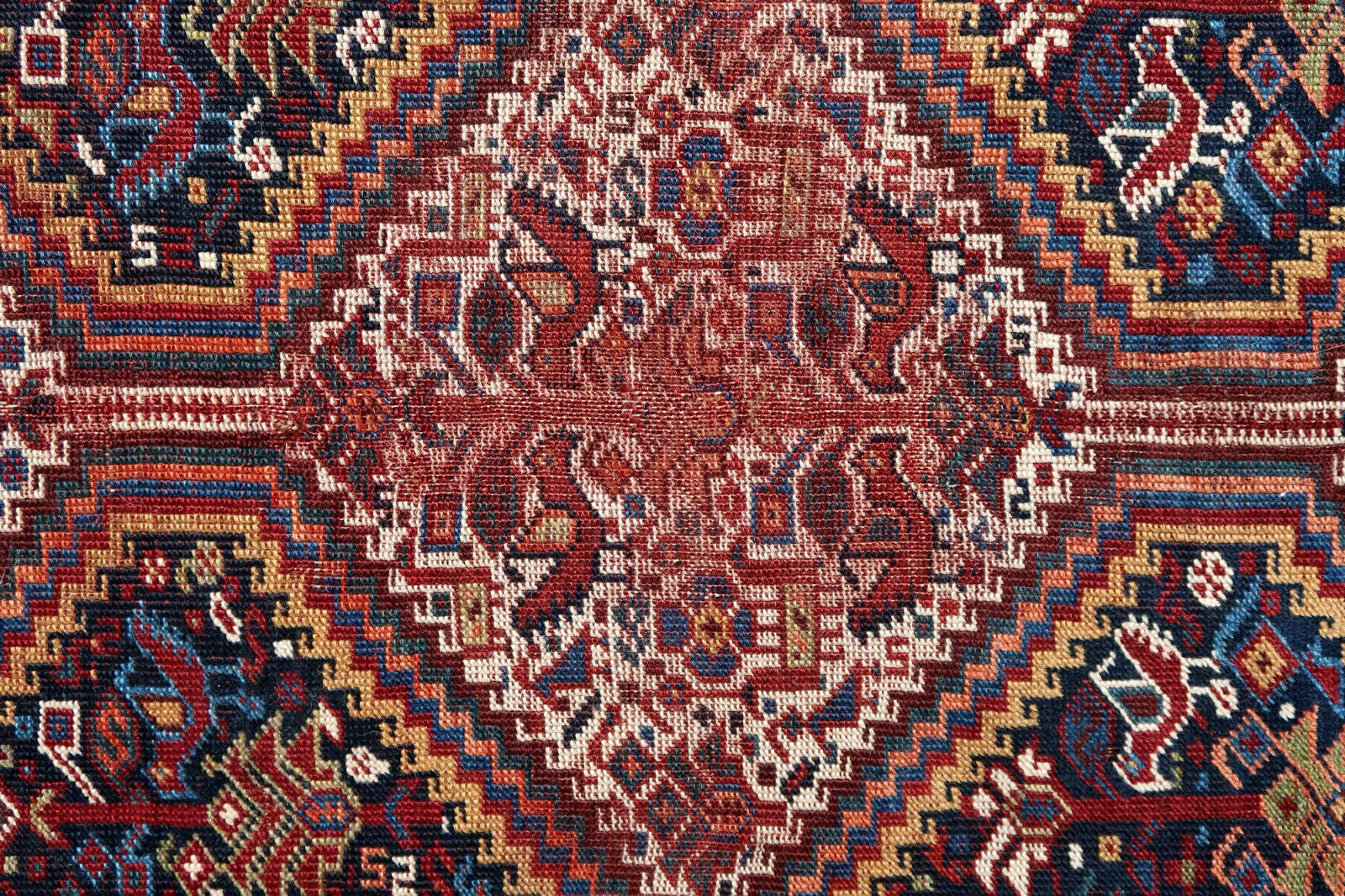Handmade antique Gashkai rug in original condition, has some age wear. The rug is from the beginning of 20th century.