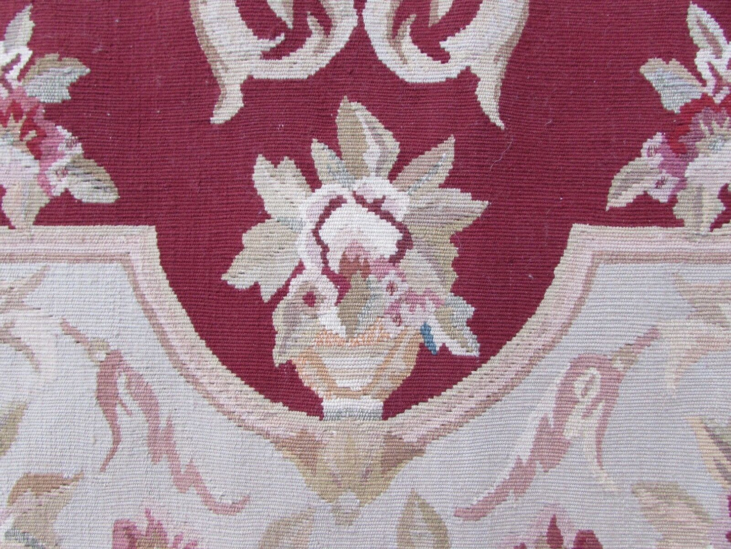 Handmade vintage French Aubusson rug in traditional design and in red and beige colors. The rug is from the end of 20th century in original good condition.