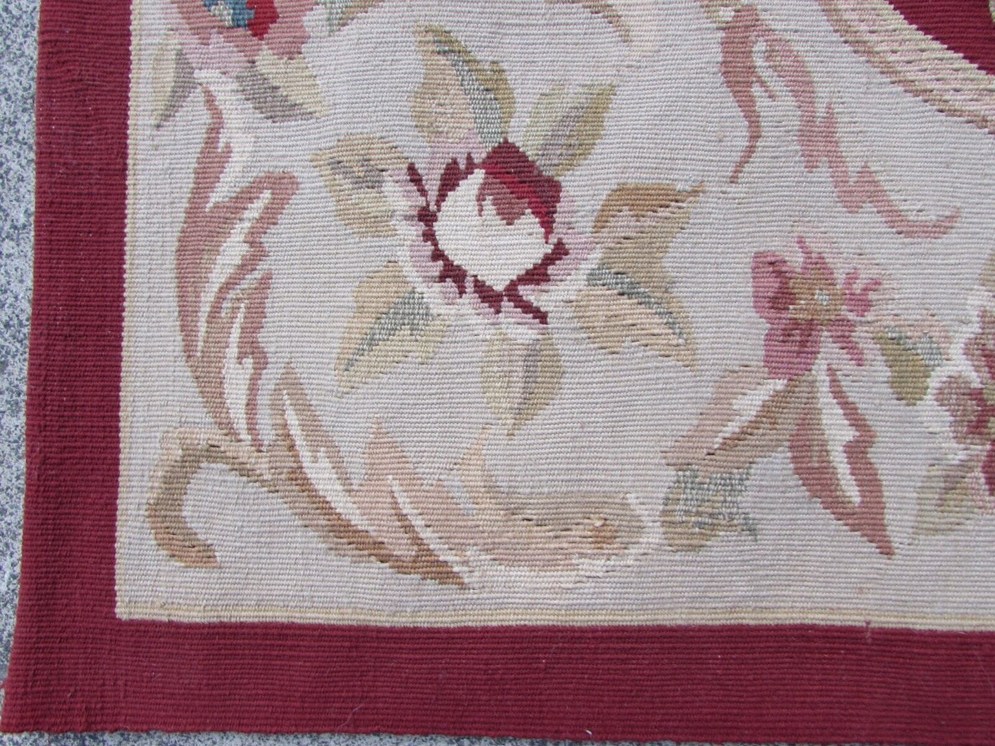 Handmade vintage French Aubusson rug in traditional design and in red and beige colors. The rug is from the end of 20th century in original good condition.