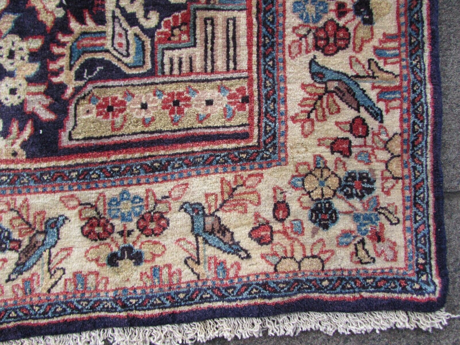 Handmade vintage Persian Kashan rug in prayer design with birds and flowers. The rug is from the end of 20th century in original good condition.