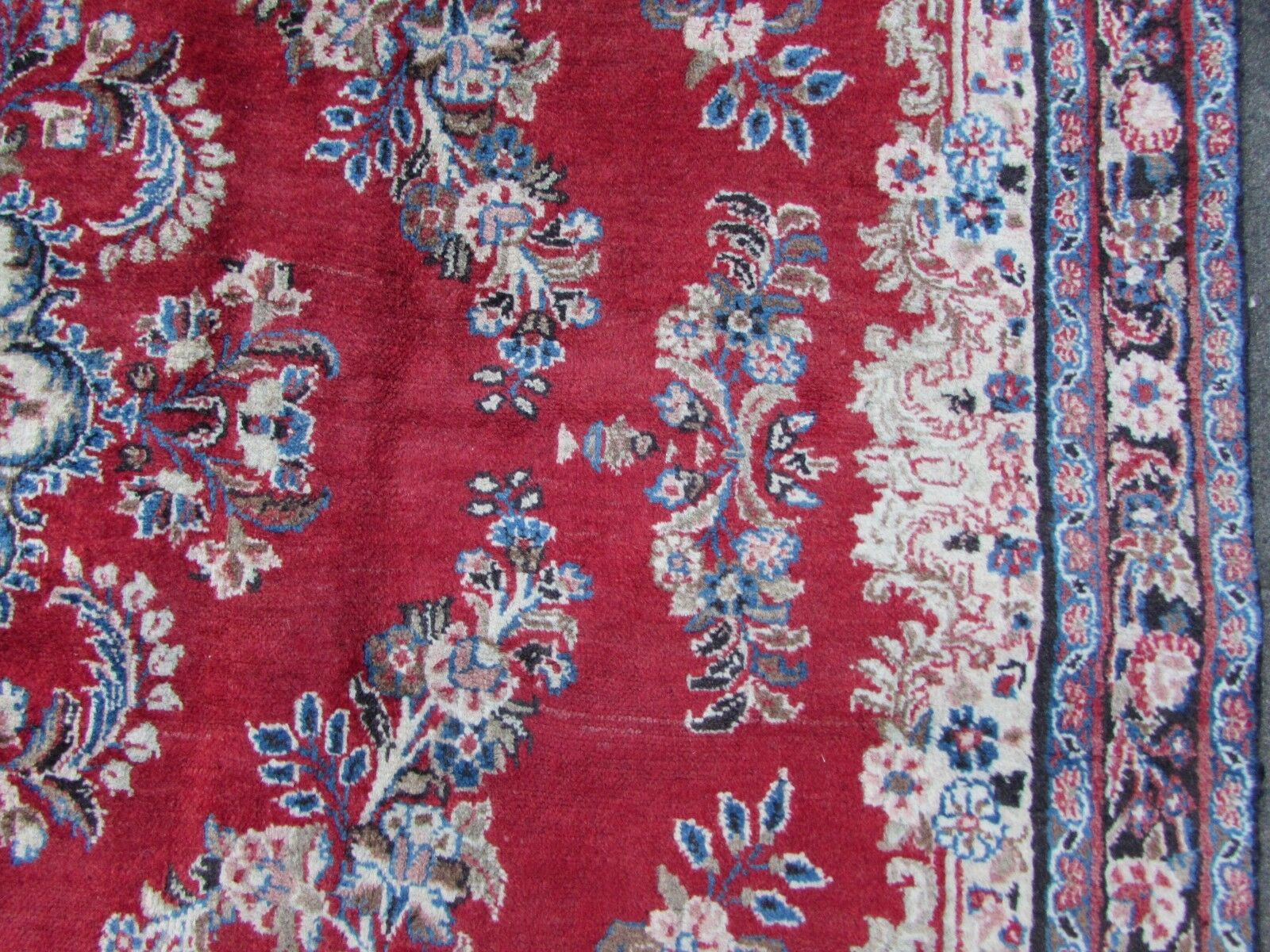 Handmade vintage Persian Kerman rug in bright red and sky blue color. The rug is from the end of 20th century in original condition, it has some low pile.