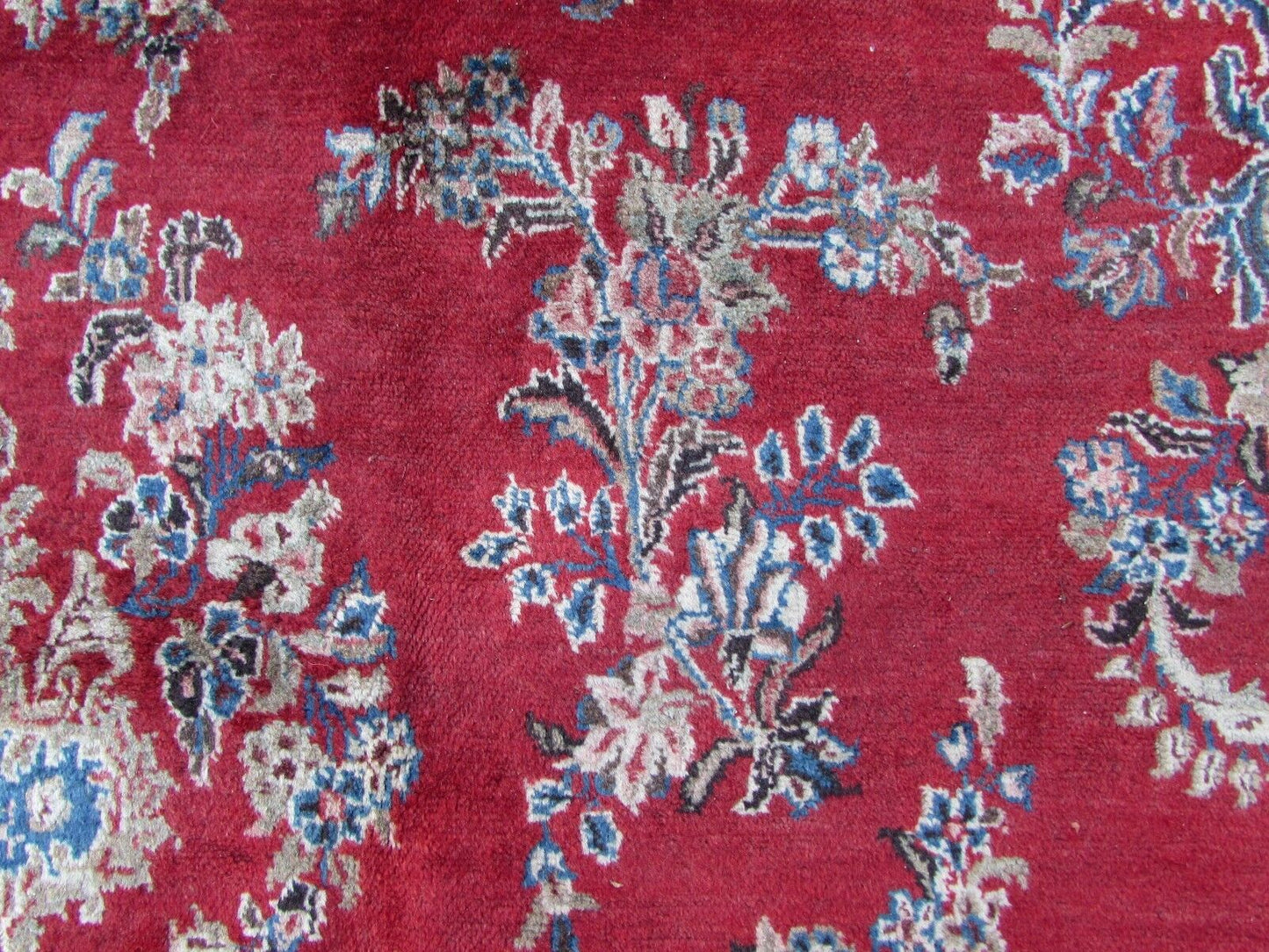 Handmade vintage Persian Kerman rug in bright red and sky blue color. The rug is from the end of 20th century in original condition, it has some low pile.