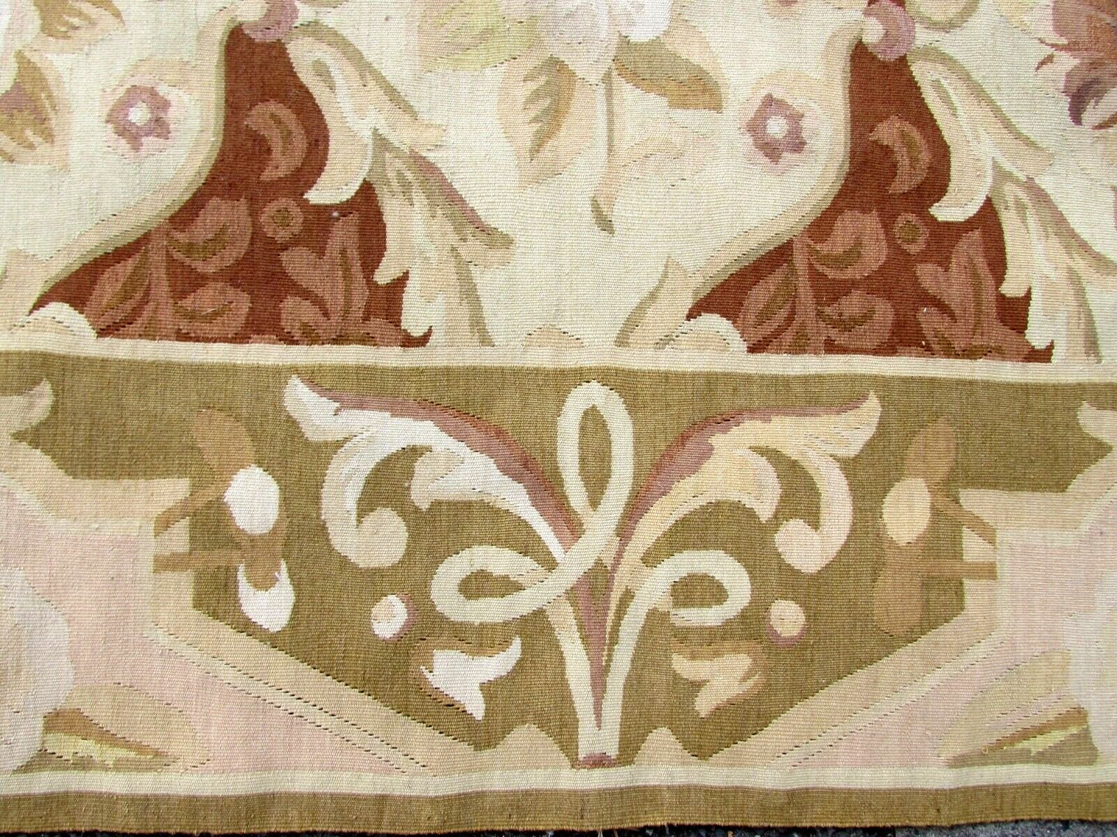 Handmade vintage French Aubusson rug in geometric design and repeating pattern. This rug has been made in the end of 20th century and in original good condition.
