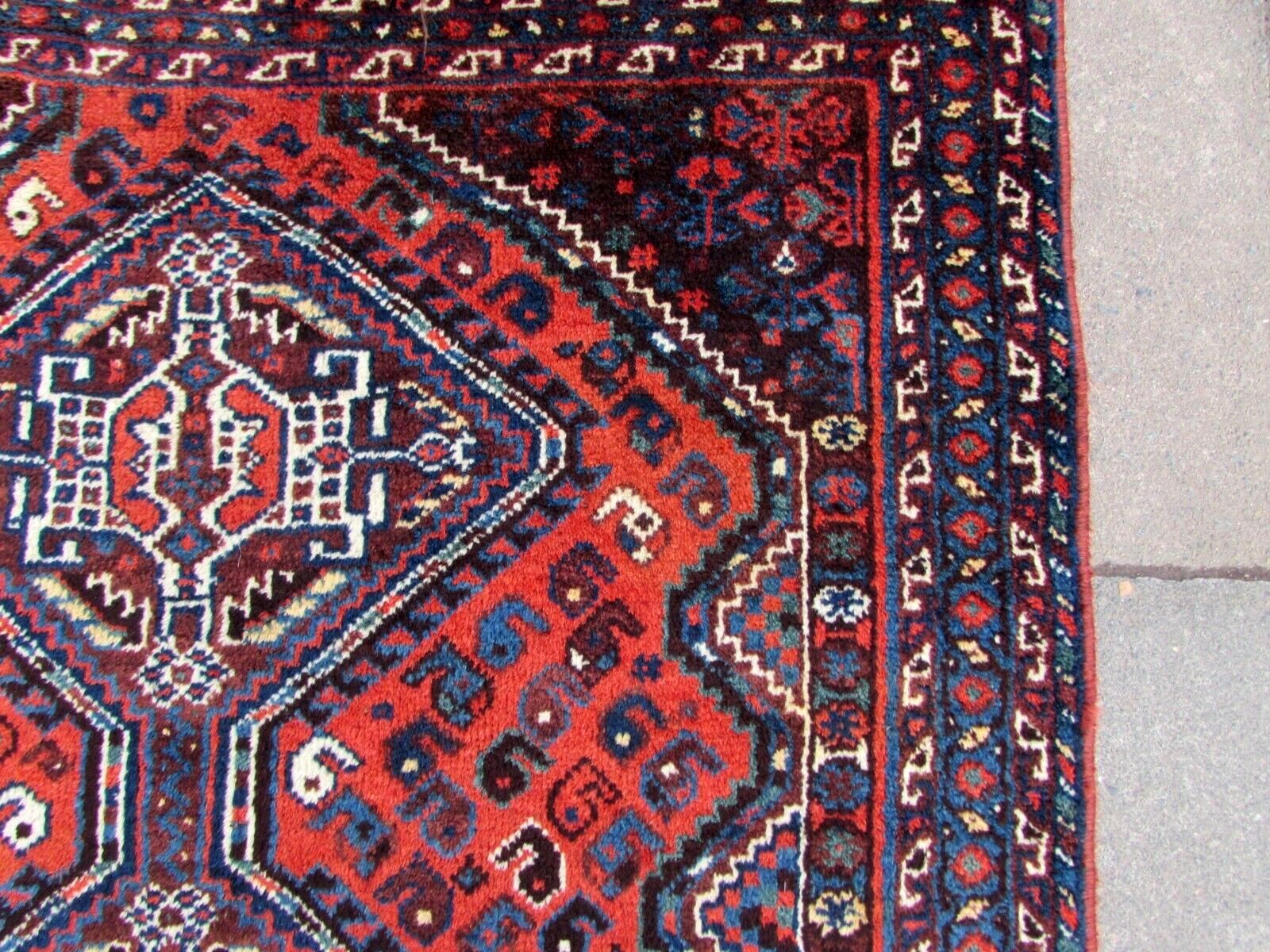 Handmade antique Persian Shiraz rug 1910s
