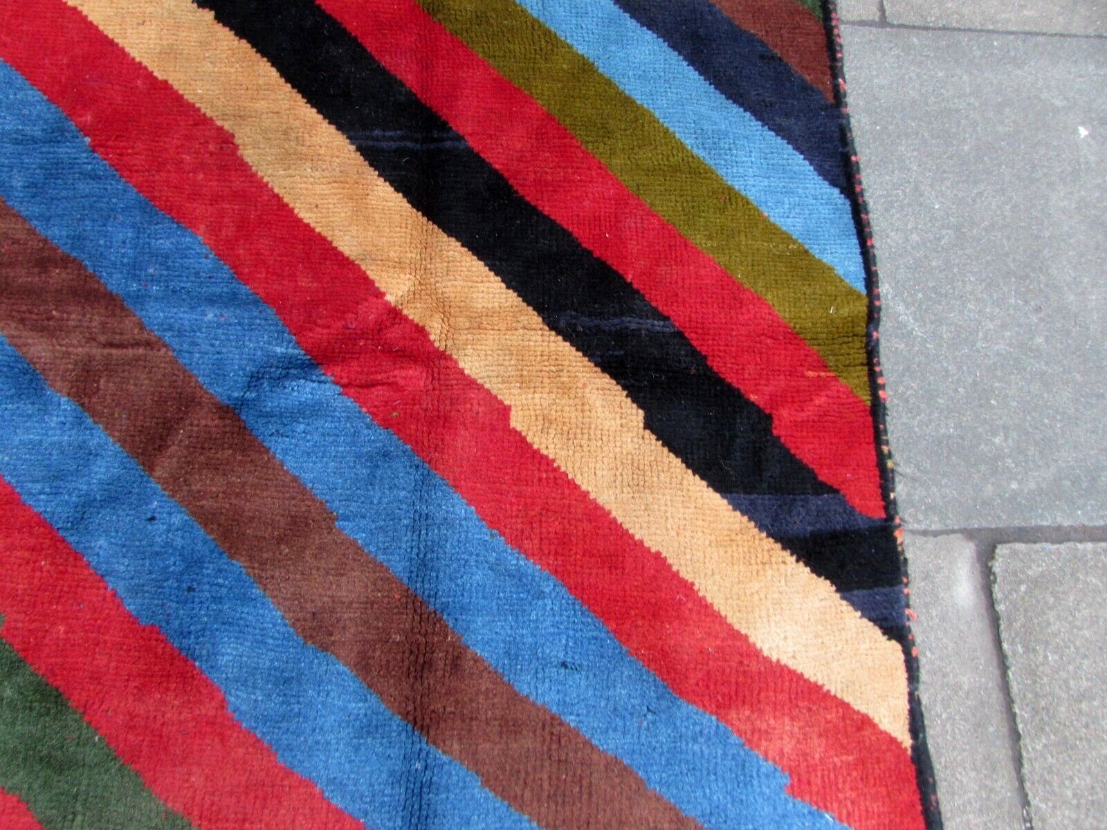 Handmade vintage Persian Gabbeh rug in colorful geometric striped design. The rug is from the end of 20th century in original good condition.