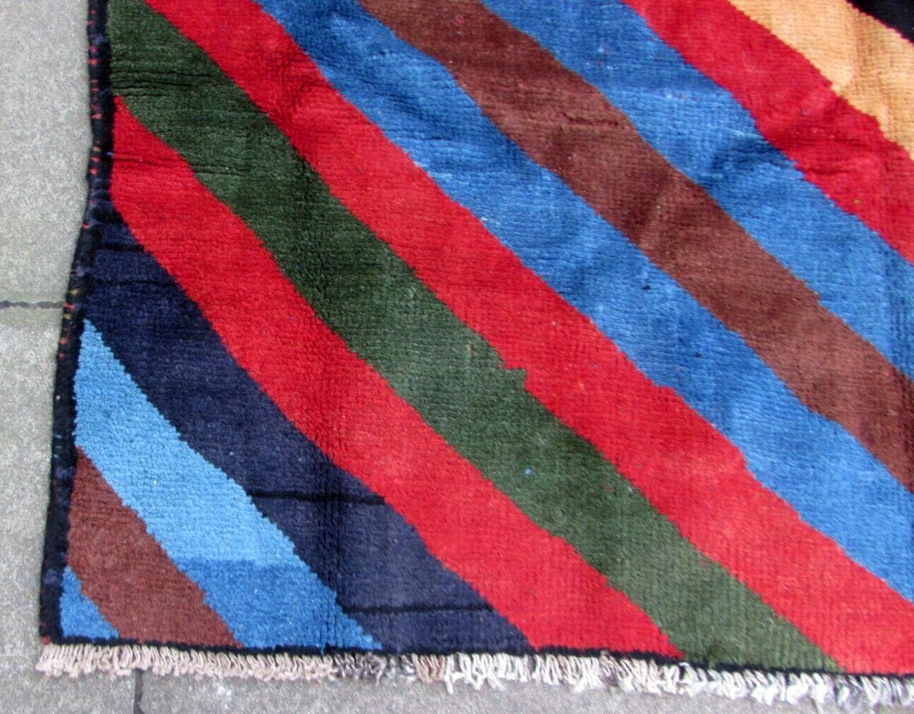Handmade vintage Persian Gabbeh rug in colorful geometric striped design. The rug is from the end of 20th century in original good condition.