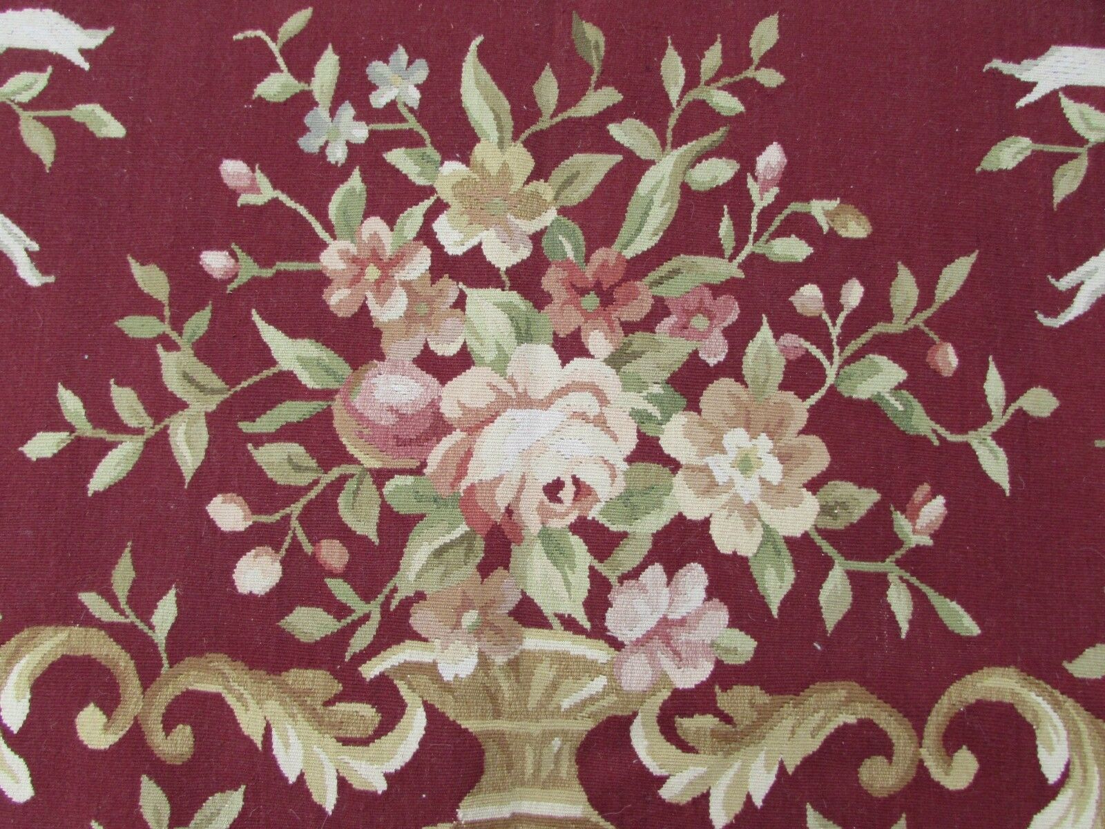 Handmade vintage French Aubusson rug in traditional floral design in burgundy and beige shades. This rug has been made in the end of 20th century and in original good condition.