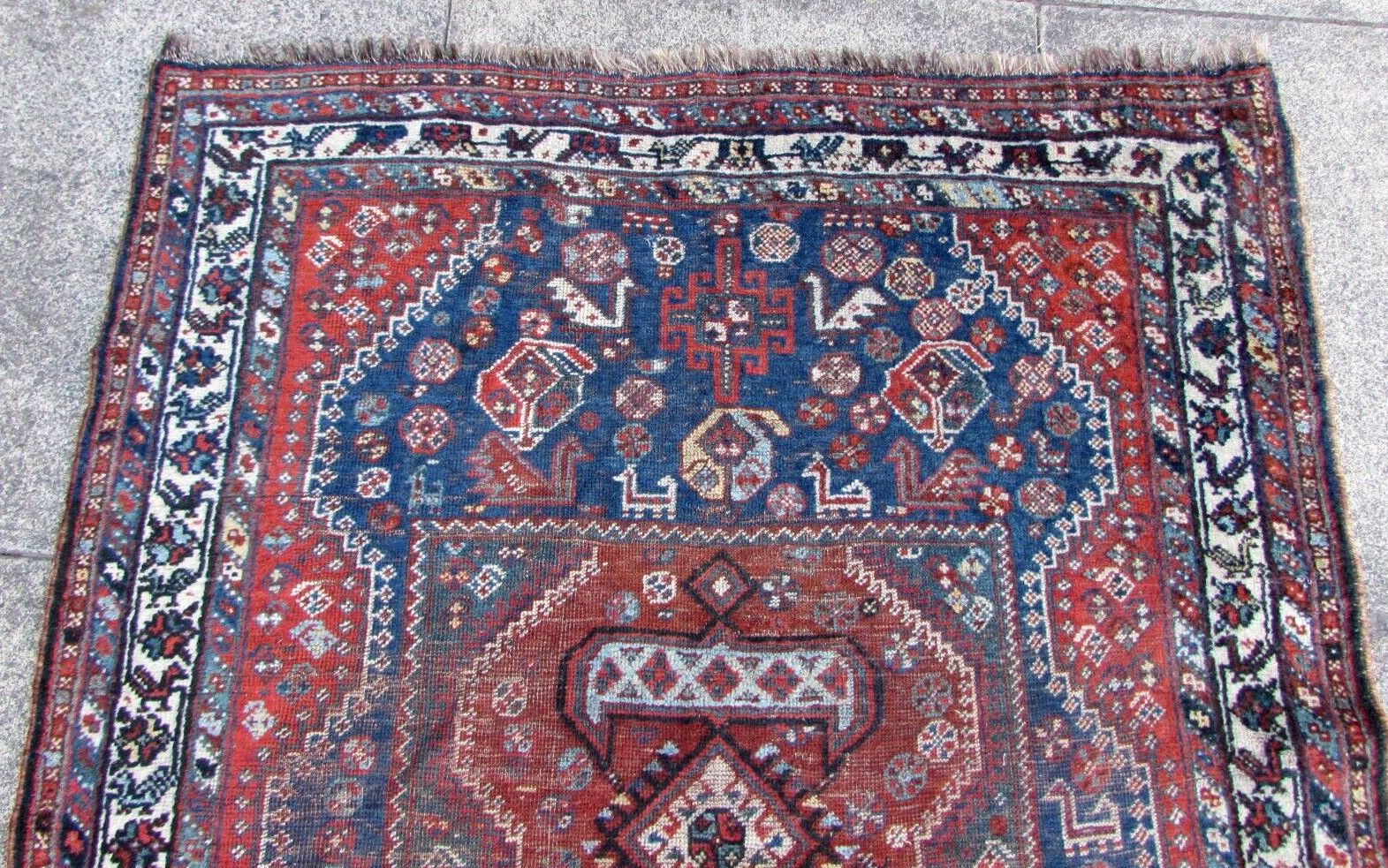 Close-up of decorative bird design on antique Persian Shiraz rug