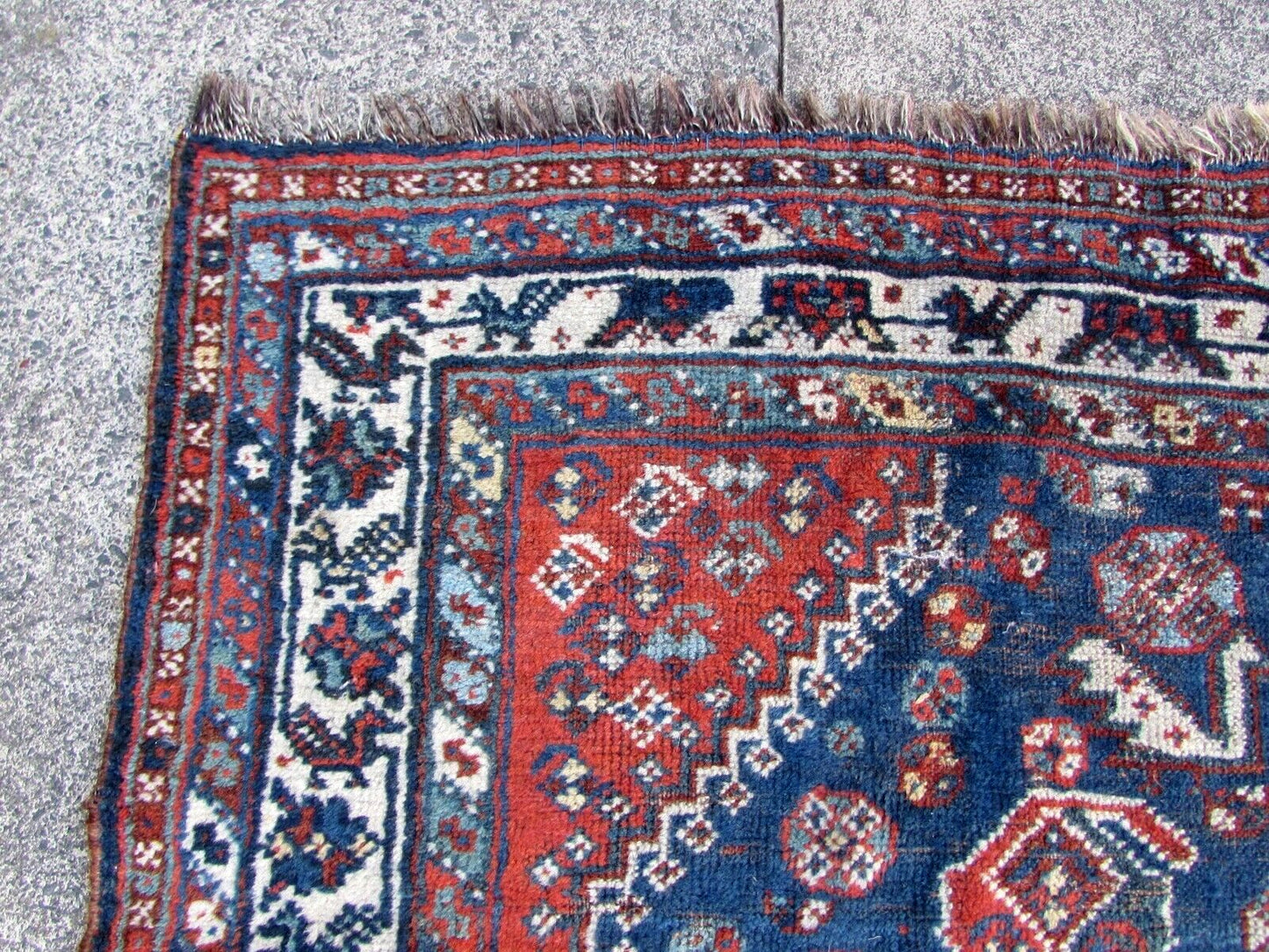 Detailed shot of the low pile on antique Middle Eastern rug