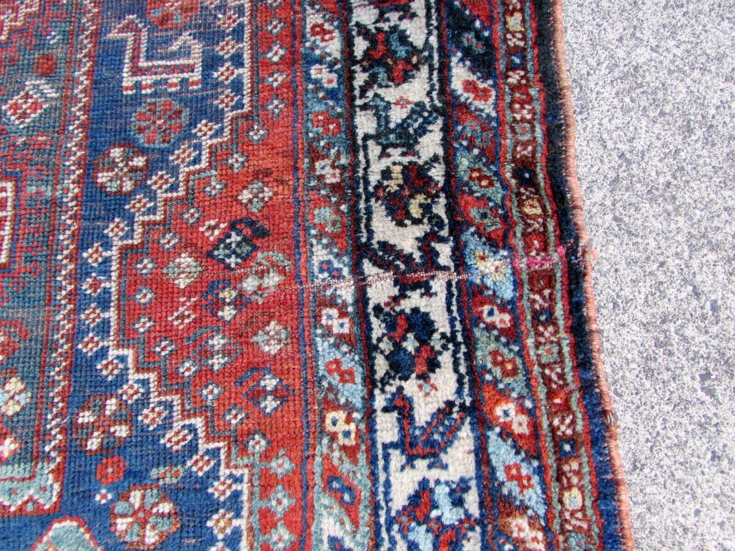 Detailed shot of the low pile on antique Middle Eastern rug