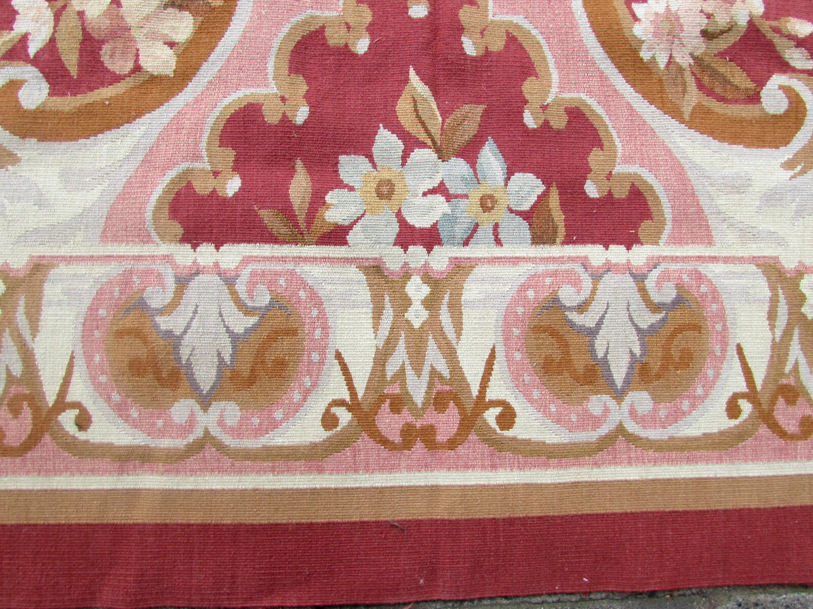 Fine craftsmanship and attention to detail showcased in a close-up of the Aubusson Rug's weaving technique