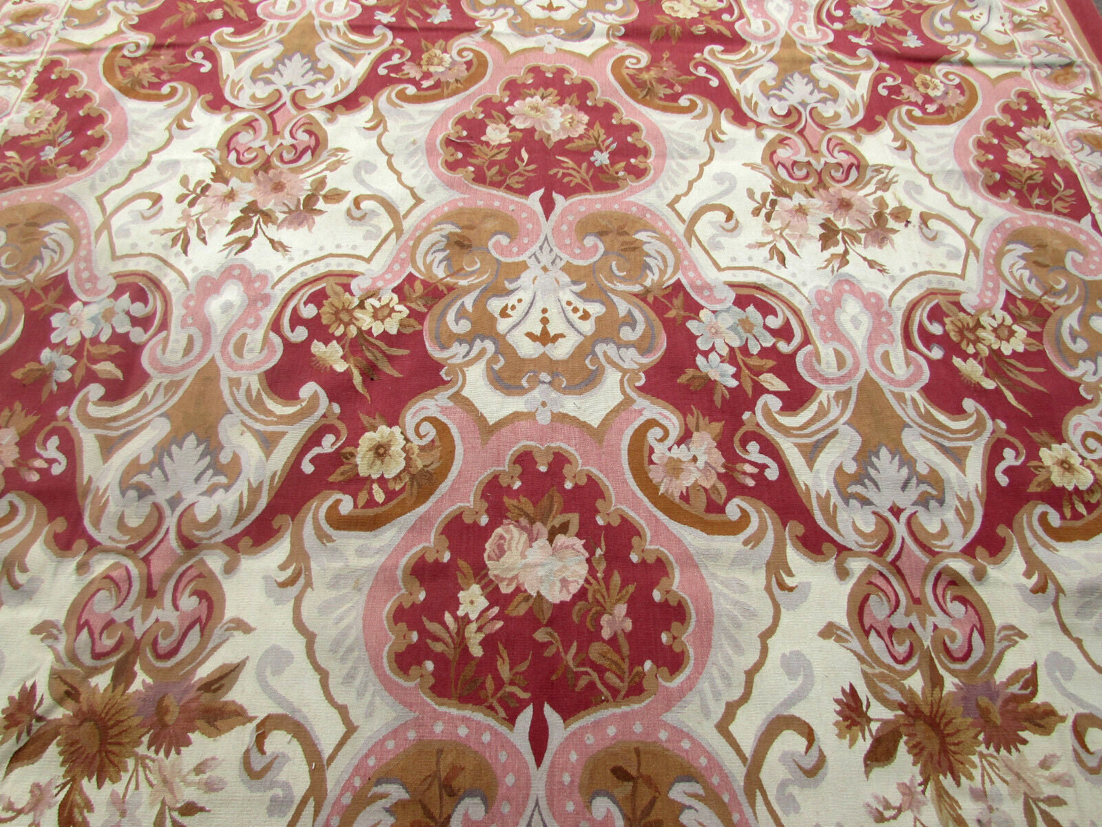 Close-up of the intricate patterns and designs on the Aubusson Rug