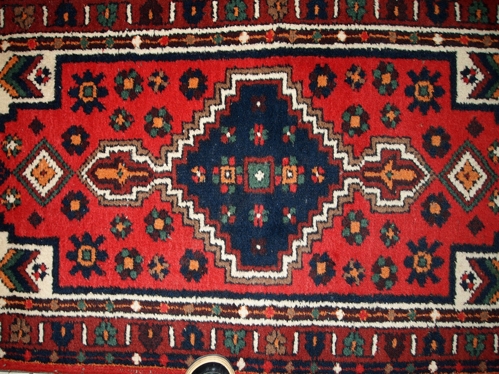 Handmade vintage Middle Eastern rug in traditional design. The rug is from the end of 20th century in original good condition. 