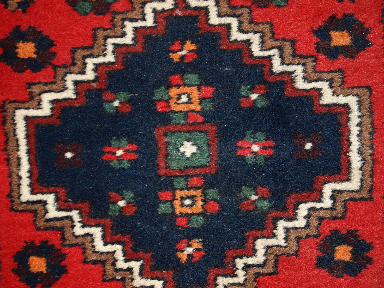 Handmade vintage Middle Eastern rug in traditional design. The rug is from the end of 20th century in original good condition. 